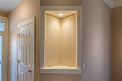 Lighted sculpture nook in foyer