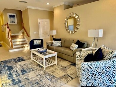 Living area featuring light tile patterned floors,