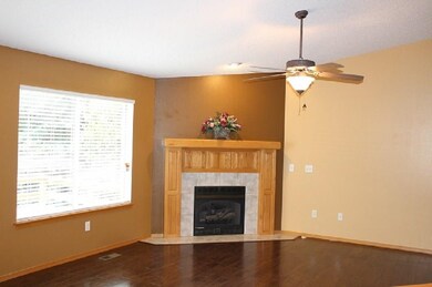 Gas log fireplace in living room.
