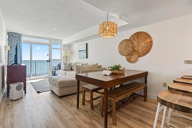 Dining room with a water view, expansive windows, 