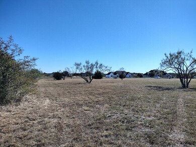 View of yard with a rural view