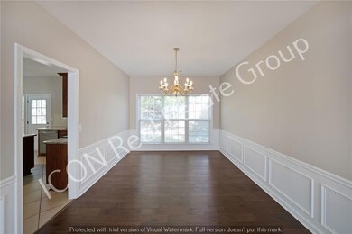 Unfurnished dining area with an inviting chandelie
