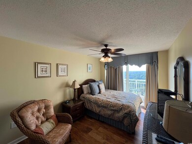 Bedroom 4 has beautiful LVP flooring, ceiling fan, access to balcony on front of building and shares a Jack and Jill bathroom.