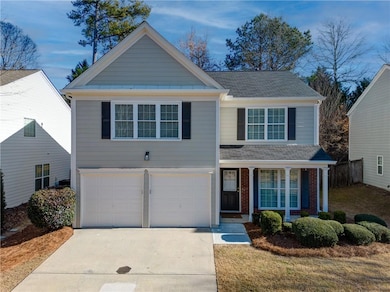 View of front facade featuring a garage and a fron