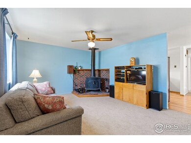 Enter and be greeted by the cozy living room complete with wood burning fireplace.
