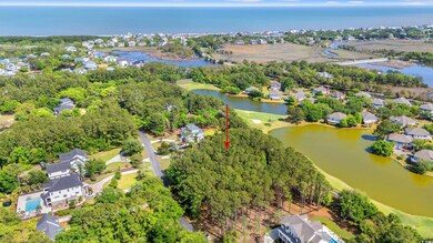 Drone / aerial view with a water view and a residential view