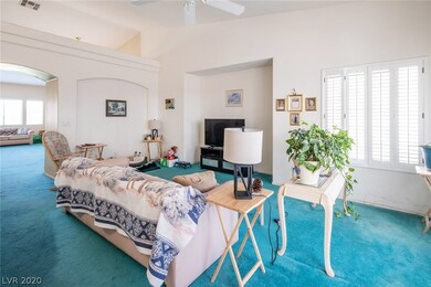Family room, showing wood shutters.