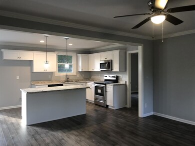 Open plan, kitchen has large island