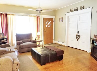 Living room has french doors that leads to the mas