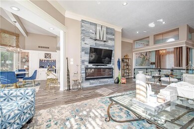 Electric fireplace on newly tiled wall.