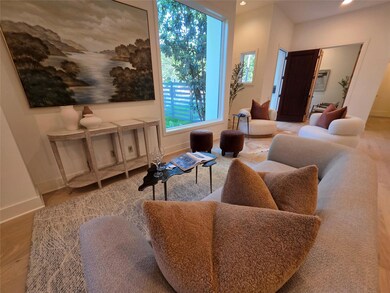 Living area with baseboards, recessed lighting, a