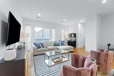 Living room featuring light hardwood / wood-style 