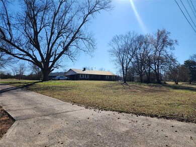 View of home's exterior featuring a yard
