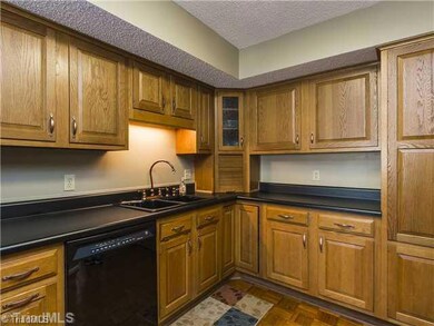 Kitchen. The kitchen offers lots of cabinets, an appliance garage, and a nice pantry with organizer system.