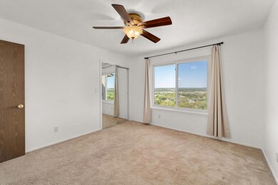 Carpeted empty room with baseboards and a ceiling