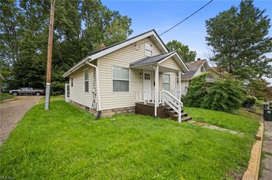 Bungalow-style home with a front yard