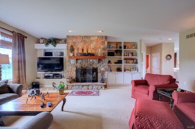 Warm and Welcoming 1 story Family Room with wood b