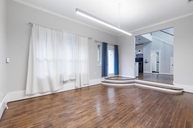 Spare room with wood finished floors, ornamental 