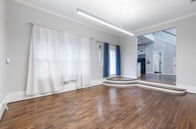 Spare room with wood finished floors, ornamental 