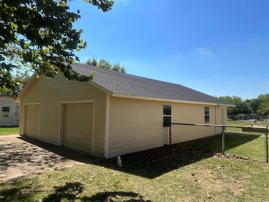 View of home's exterior featuring an outbuilding, 