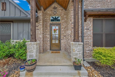 Property entrance featuring board and batten sidin