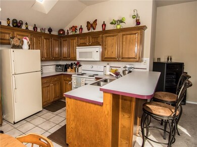 Well organized kitchen space with breakfast bar.