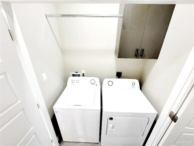 Laundry area with cabinet space and washer and dryer