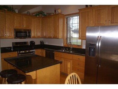 The kitchen has been updated with stainless steel 