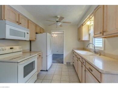 Kitchen features newer cabinets, counter tops, sin
