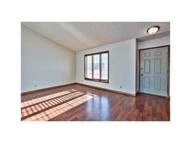 Living Room. NEUTRAL WALL COLOR, UPGRADED WOOD LAM