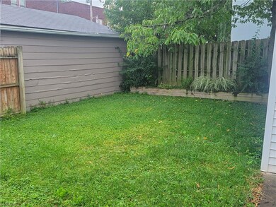 The yard offers privacy and area for planting.