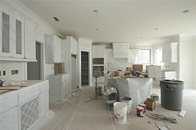 Large island, wood floors and stainless steal appl