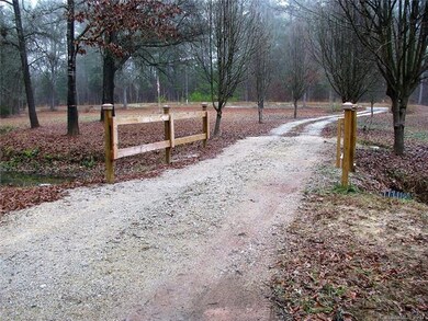 Bridge covered stream on entrance to home.