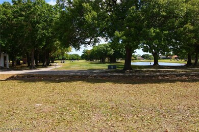 View from the center back lot line lookin east towards the 10th tee and lake, with the practice facilities in the distance on the far right.