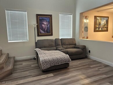 Living room featuring baseboards and wood finished