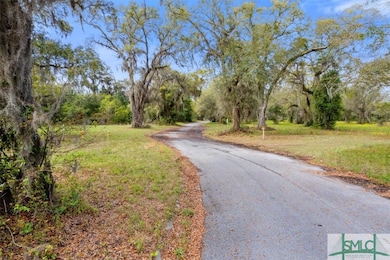 Road into the neighborhood. Lot 9 on the RIGHT