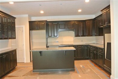 Huge kitchen with island, double ovens, cooktop, h