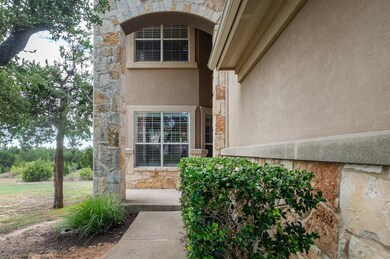 Doorway to property with stone siding and stucco 
