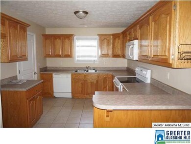 Kitchen with lots of cabinets and counter tops