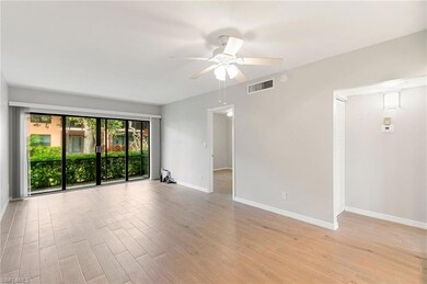 Empty room featuring light wood finished floors and ceiling fan
