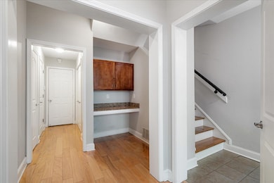Interior space with baseboards, light wood-style f