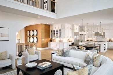 Photo from the Roswell Model Home: Living room featuring light wood-type flooring and recessed lighting