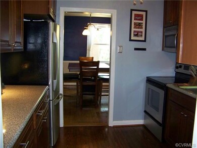 VIEW IN TO FORMAL DINING ROOM FROM KITCHEN.