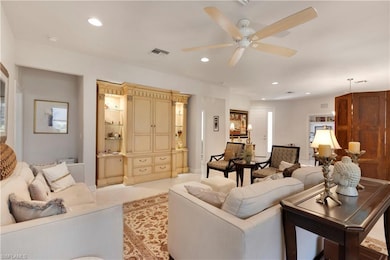 Living room featuring light tile patterned floors,