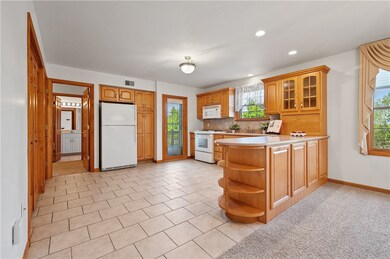 The kitchen is light and bright. It offers beautif