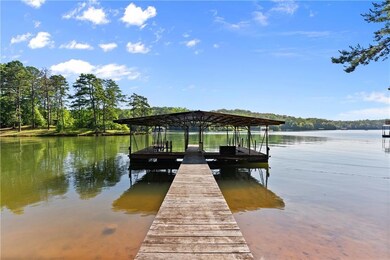 Dock area featuring a water view and boat lift