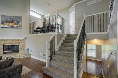Decorator stair carpet with wrought iron spindles.