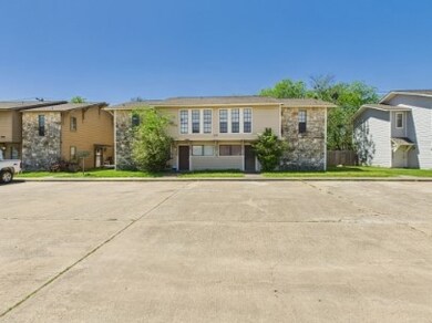 View of front of property featuring uncovered park