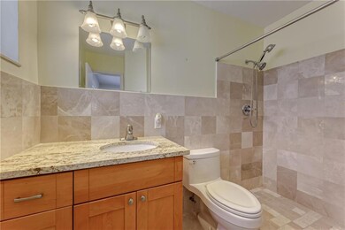 Master bathroom with walk in marble shower and mar