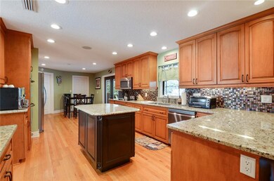 The window over the sink brings in natural light a